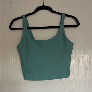 Cropped work out tank top with built in bra. Brand new without tags.